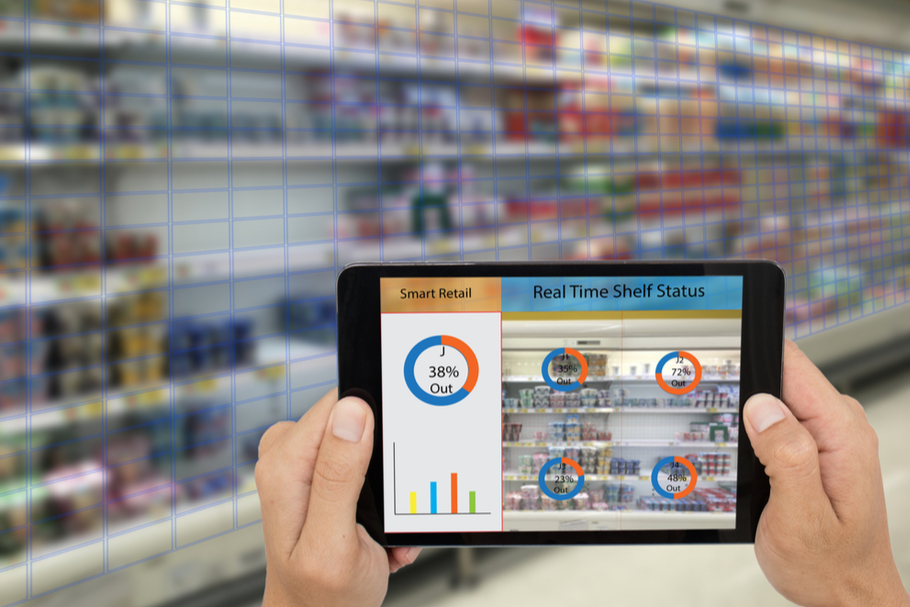 A person holds their tablet up to a grocery store shelf and is able to see the real-time status of the food stocked on it.